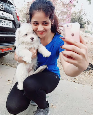 Priyanka Jawalkar taking selfie with her dog
