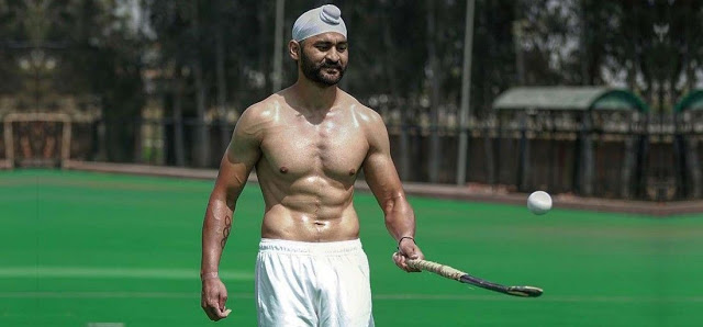 Sandeep Singh juggling the ball with a hockey stick 