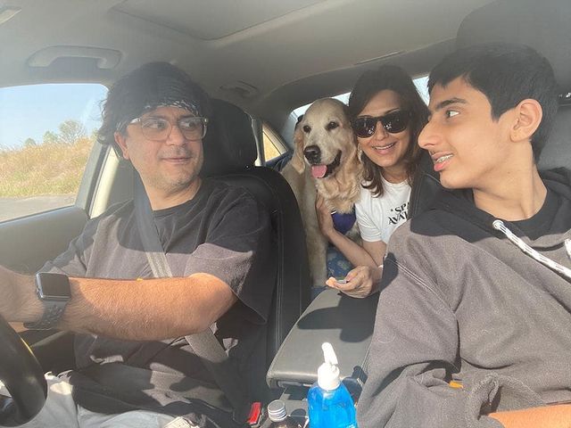 Sonali Bendre with her husband and son in a car